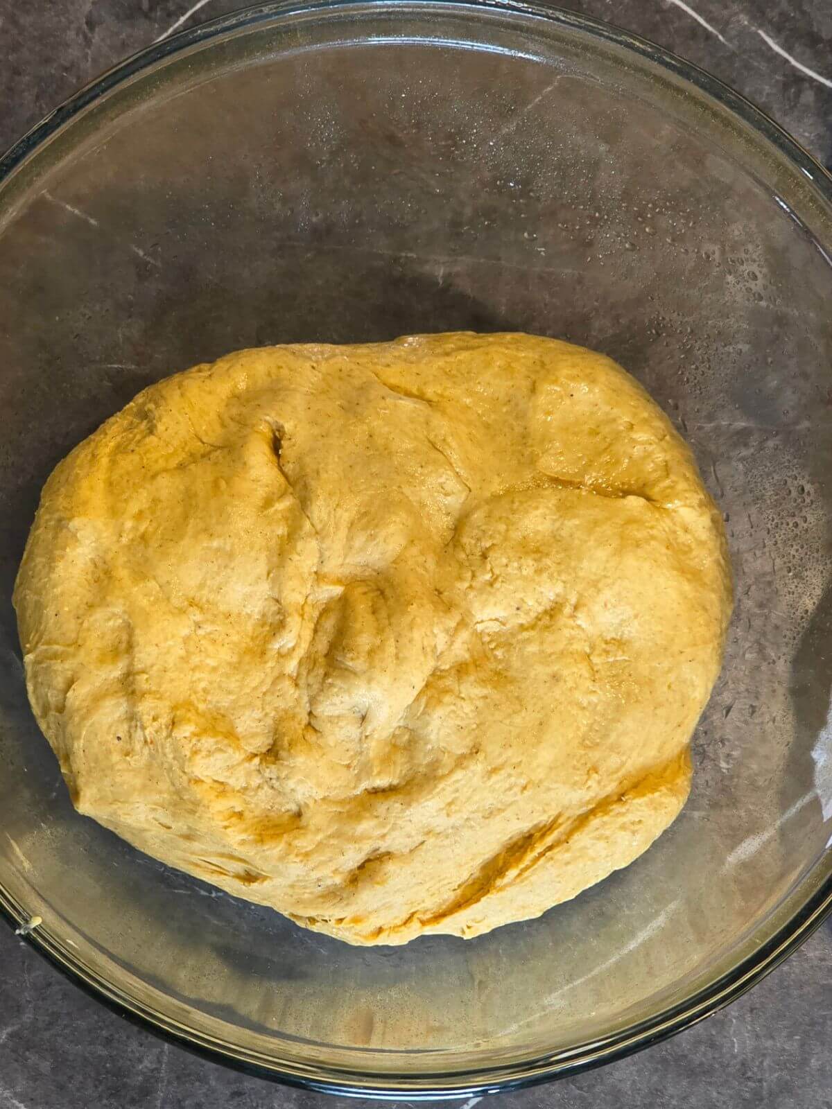 Sourdough pumpkin cinnamon roll dough mixed and ready for bulk fermentation.