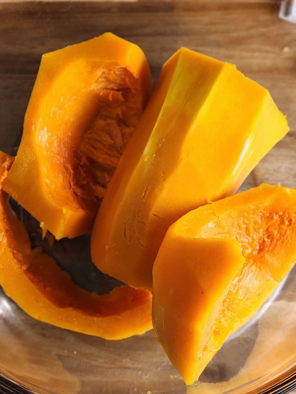 Peeled butternut squash cut into large sections with seeds removed.