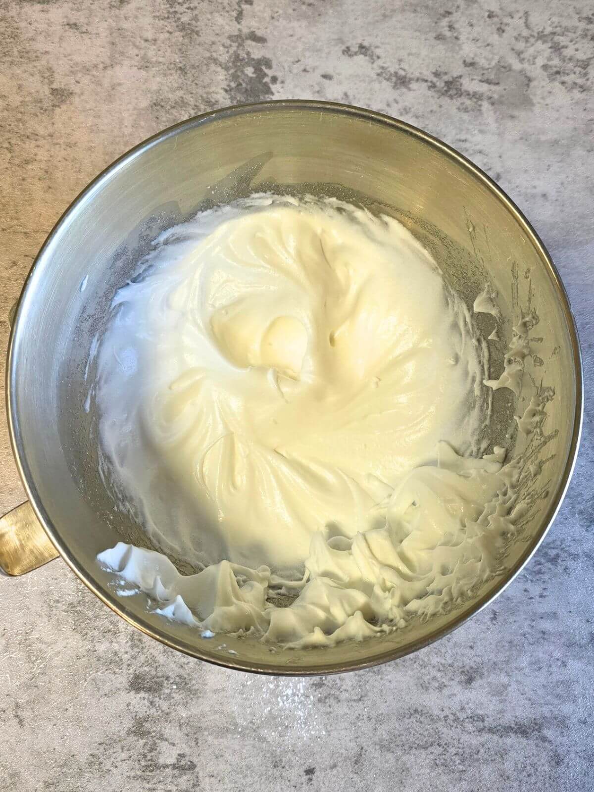 Egg whites whipped to stiff peaks for soda cracker peach pie crust.