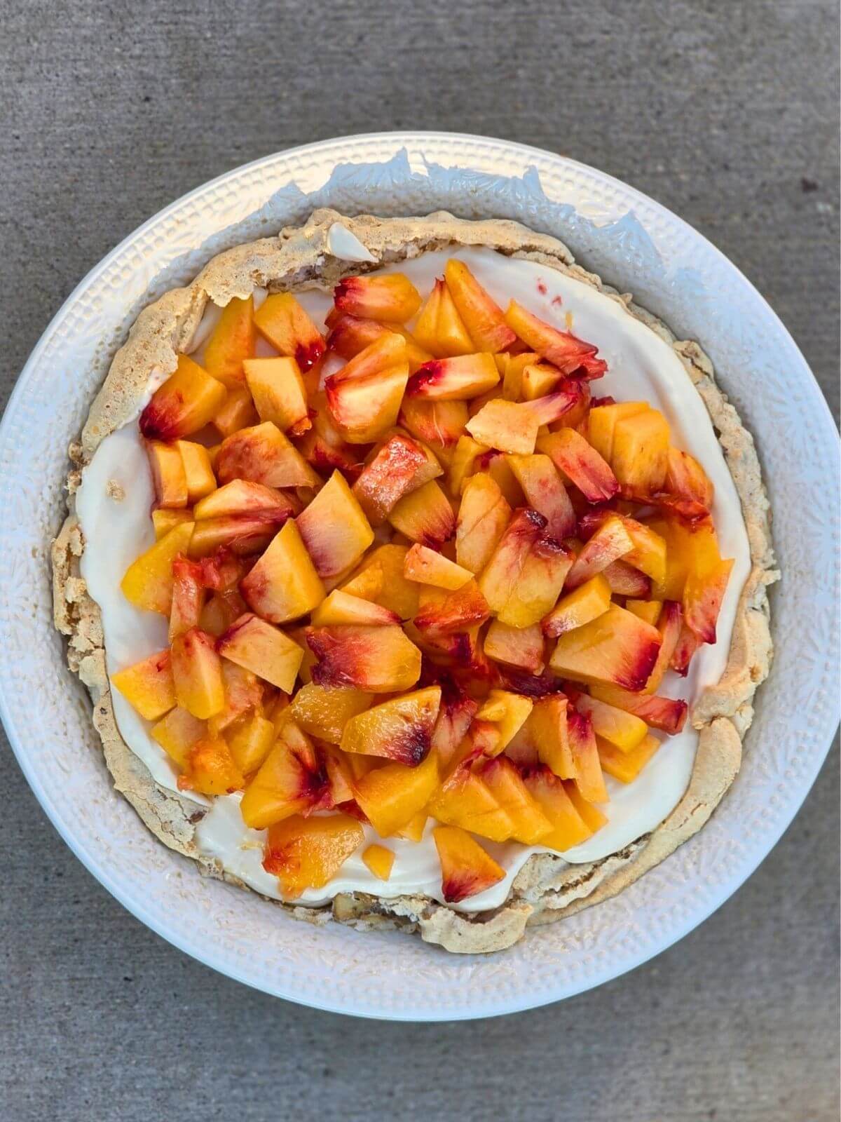 Fresh peach pie with soda cracker crust and cream cheese filling.