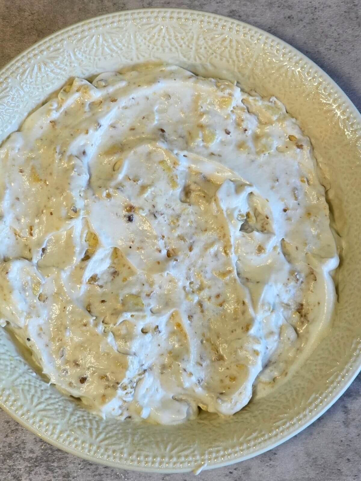 Soda cracker meringue crust mixture spread into a pie plate