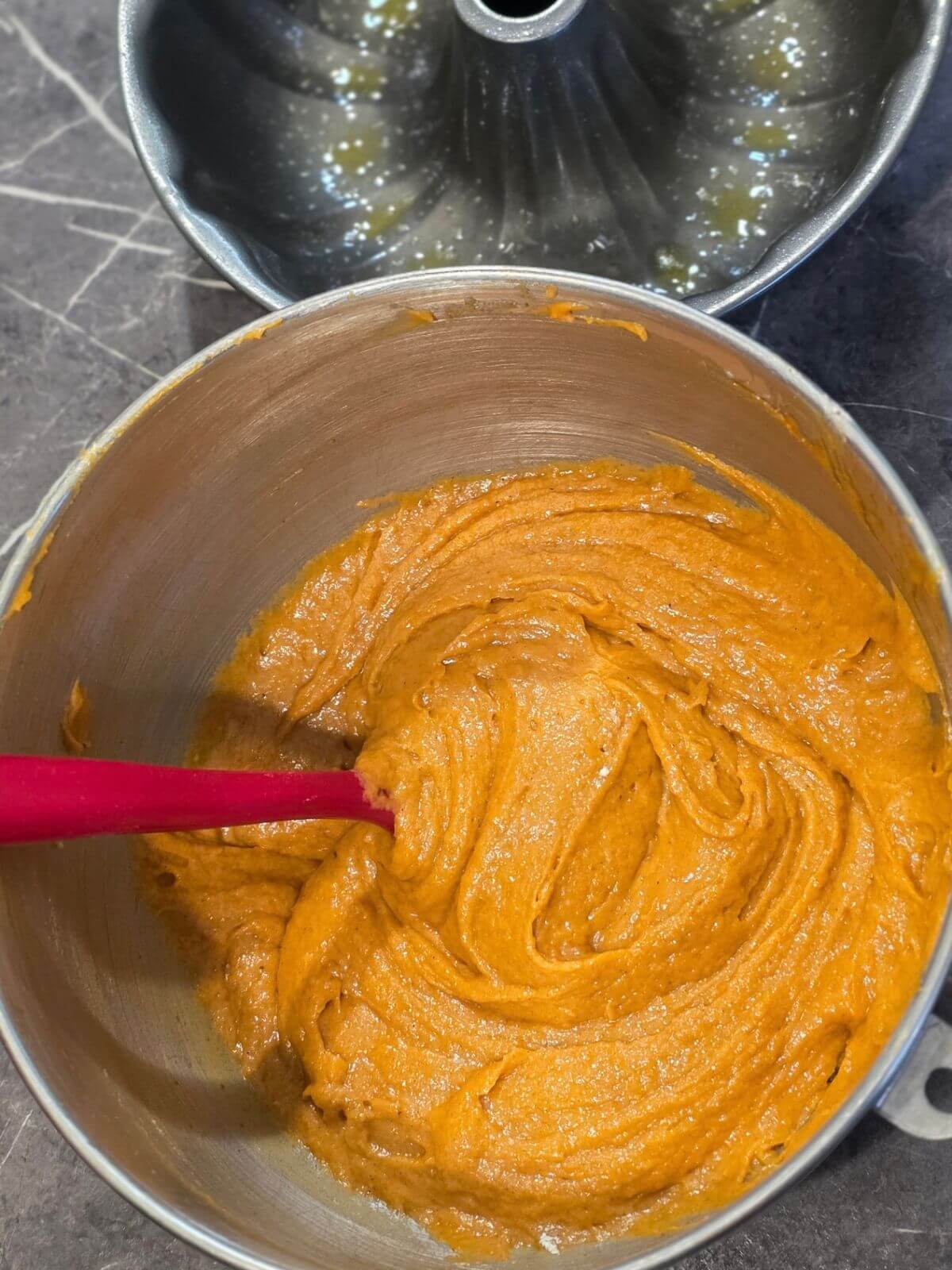 Thick pumpkin spice Bundt cake batter mixed and ready to transfer to the pan.